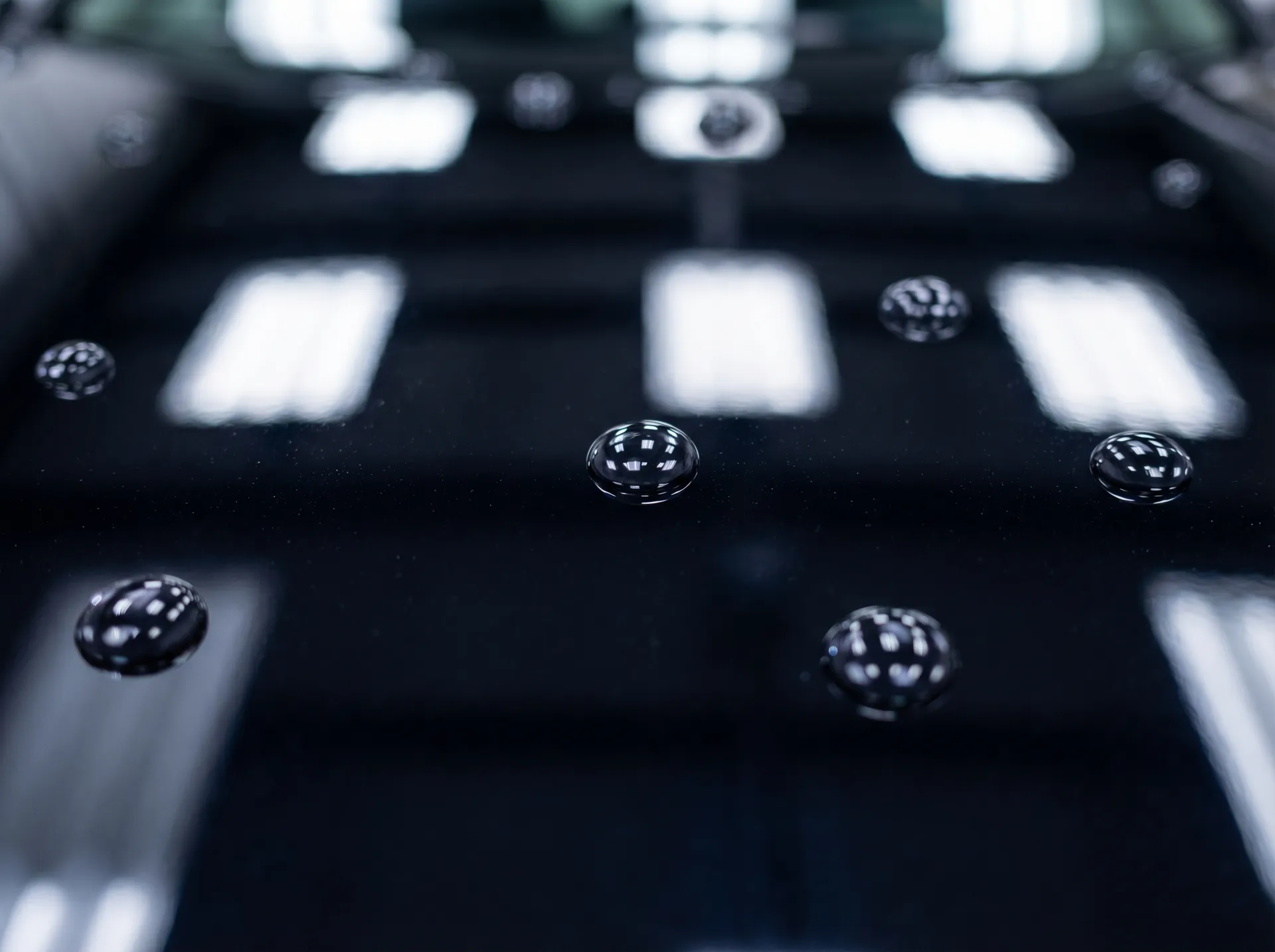 Water beading into pearls on ceramic coated car paint years after installation