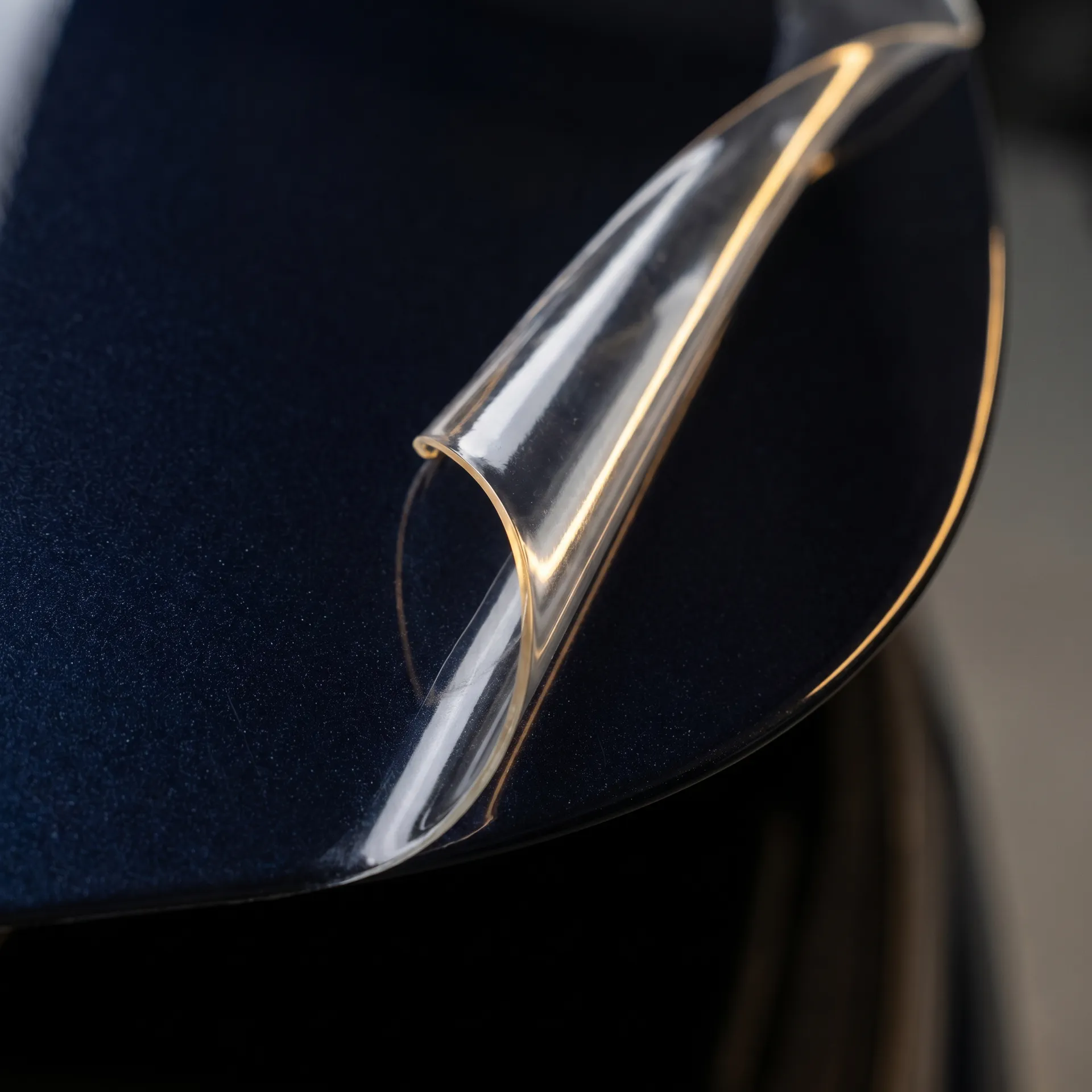 Close-up of paint protection film edge on luxury car paint in Toronto