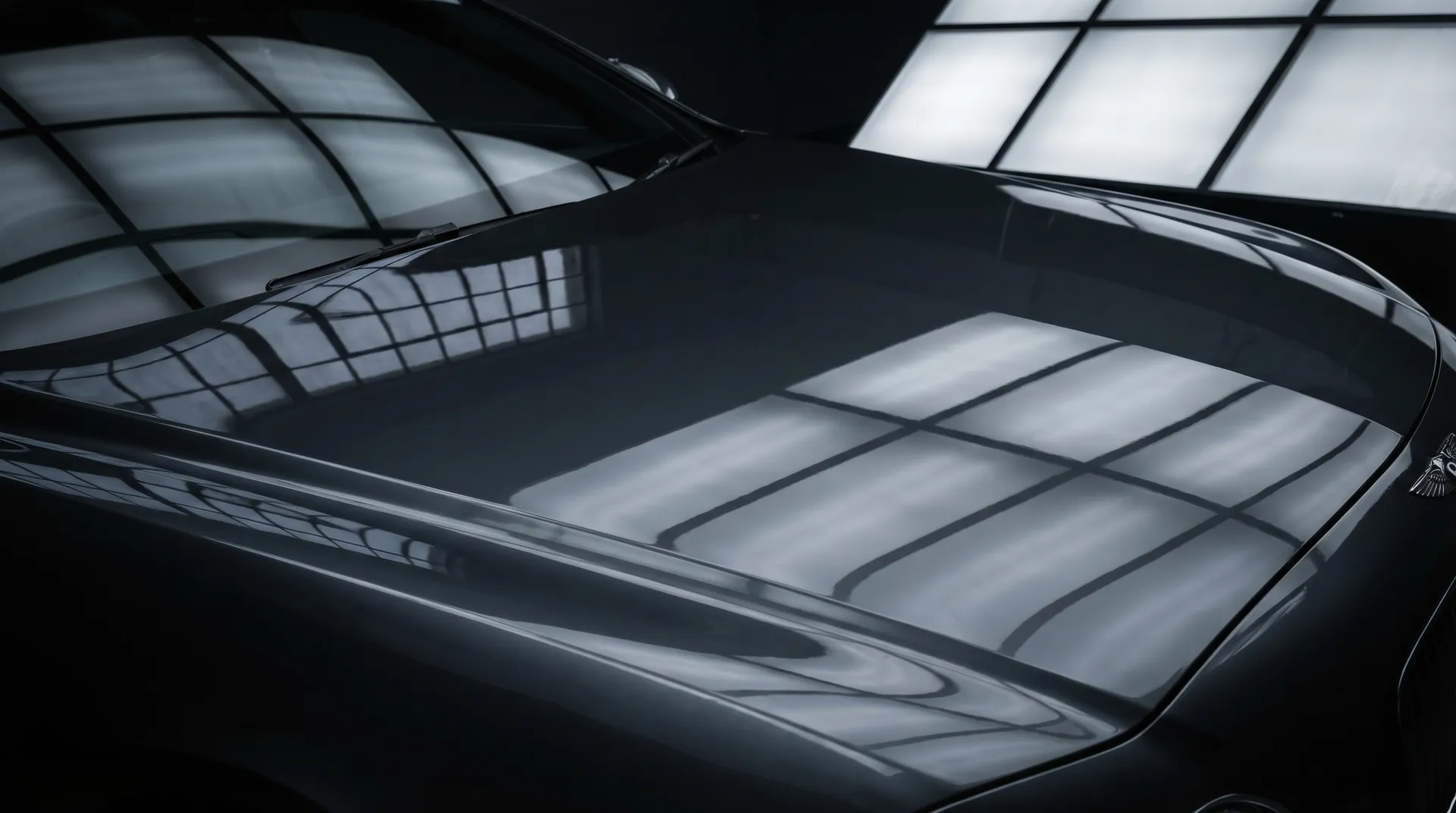 Mirror-finish car hood after professional paint correction